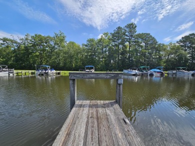Beautiful .50-acre level building lot with a Boat Slip in Wyboo on Players Course At Wyboo Plantation in South Carolina - for sale on GolfHomes.com, golf home, golf lot