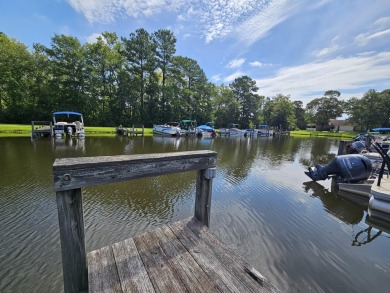 Beautiful .50-acre level building lot with a Boat Slip in Wyboo on Players Course At Wyboo Plantation in South Carolina - for sale on GolfHomes.com, golf home, golf lot