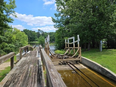 Beautiful .50-acre level building lot with a Boat Slip in Wyboo on Players Course At Wyboo Plantation in South Carolina - for sale on GolfHomes.com, golf home, golf lot