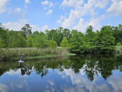 Beautiful .50-acre level building lot with a Boat Slip in Wyboo on Players Course At Wyboo Plantation in South Carolina - for sale on GolfHomes.com, golf home, golf lot