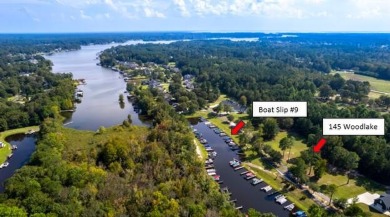 Beautiful .50-acre level building lot with a Boat Slip in Wyboo on Players Course At Wyboo Plantation in South Carolina - for sale on GolfHomes.com, golf home, golf lot