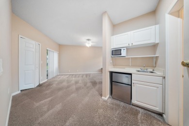 Bottom floor unit 2 bedroom and 2.5 bath located in Castle Pines on The Legacy Golf and Tennis Club in Florida - for sale on GolfHomes.com, golf home, golf lot