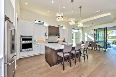 Stunning custom residence offering picturesque lake and on Miromar Lakes Golf Club in Florida - for sale on GolfHomes.com, golf home, golf lot