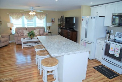 Updated and move-in ready, this residence is nestled in the on Six Lakes Country Club in Florida - for sale on GolfHomes.com, golf home, golf lot