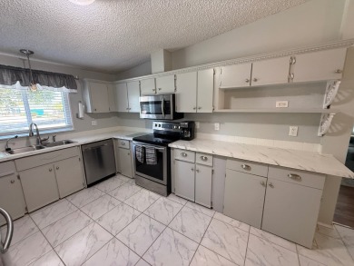 Located in highly sought after Pine Lakes, an Executive 18 Hole on Pine Lakes Country Club in Florida - for sale on GolfHomes.com, golf home, golf lot