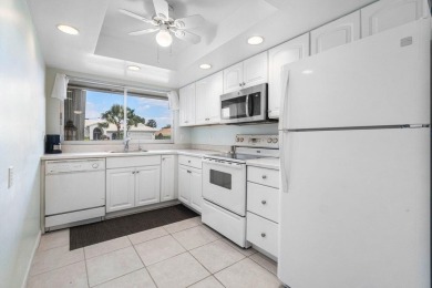 Wonderful First Floor 2 bedroom 2 bath end unit condo with on BallenIsles Golf and Country Club in Florida - for sale on GolfHomes.com, golf home, golf lot
