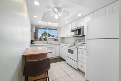 Wonderful First Floor 2 bedroom 2 bath end unit condo with on BallenIsles Golf and Country Club in Florida - for sale on GolfHomes.com, golf home, golf lot