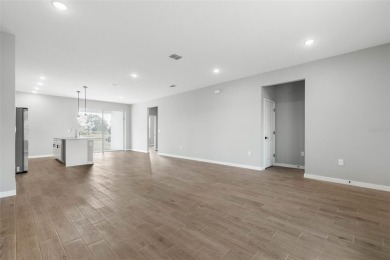 One or more photo(s) has been virtually staged. Walk to PINE on The Grand Club - Pine Lakes Course in Florida - for sale on GolfHomes.com, golf home, golf lot
