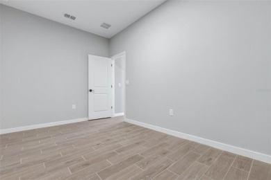One or more photo(s) has been virtually staged. Walk to PINE on The Grand Club - Pine Lakes Course in Florida - for sale on GolfHomes.com, golf home, golf lot