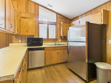 Welcome to an investor's dream! This offering includes a on Whispering Pines Golf Course in North Carolina - for sale on GolfHomes.com, golf home, golf lot