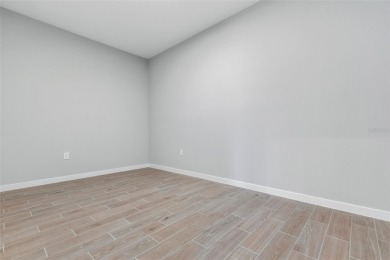 One or more photo(s) has been virtually staged. Walk to PINE on The Grand Club - Pine Lakes Course in Florida - for sale on GolfHomes.com, golf home, golf lot