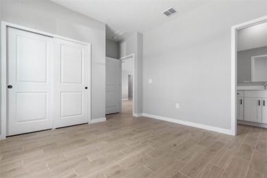 One or more photo(s) has been virtually staged. Walk to PINE on The Grand Club - Pine Lakes Course in Florida - for sale on GolfHomes.com, golf home, golf lot