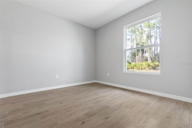 One or more photo(s) has been virtually staged. Walk to PINE on The Grand Club - Pine Lakes Course in Florida - for sale on GolfHomes.com, golf home, golf lot