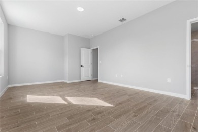 One or more photo(s) has been virtually staged. Walk to PINE on The Grand Club - Pine Lakes Course in Florida - for sale on GolfHomes.com, golf home, golf lot