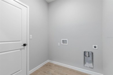 One or more photo(s) has been virtually staged. Walk to PINE on The Grand Club - Pine Lakes Course in Florida - for sale on GolfHomes.com, golf home, golf lot