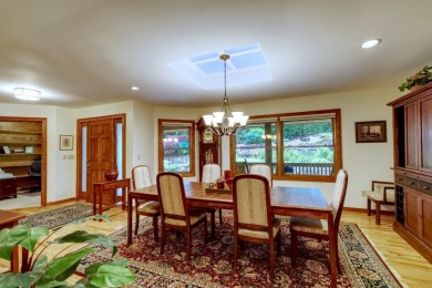 You will love coming home to this attractive and comfortable on Sapphire National Golf Club in North Carolina - for sale on GolfHomes.com, golf home, golf lot