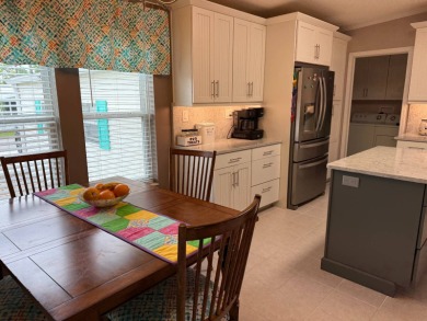 This lovely, 3 bedroom, 2 bath manufactured home is located in on Pine Lakes Country Club in Florida - for sale on GolfHomes.com, golf home, golf lot