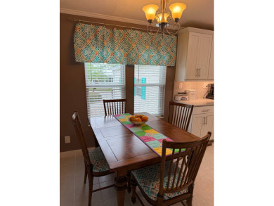 This lovely, 3 bedroom, 2 bath manufactured home is located in on Pine Lakes Country Club in Florida - for sale on GolfHomes.com, golf home, golf lot