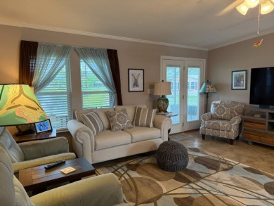 This lovely, 3 bedroom, 2 bath manufactured home is located in on Pine Lakes Country Club in Florida - for sale on GolfHomes.com, golf home, golf lot