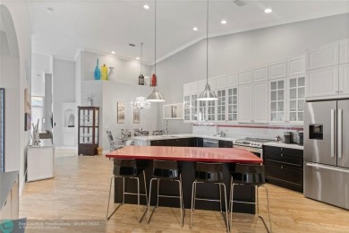 Very rarely available corner villa overlooking a canal and the on Palm-Aire Country Club and Resort - The Oaks in Florida - for sale on GolfHomes.com, golf home, golf lot