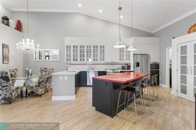 Very rarely available corner villa overlooking a canal and the on Palm-Aire Country Club and Resort - The Oaks in Florida - for sale on GolfHomes.com, golf home, golf lot