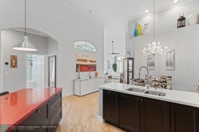Very rarely available corner villa overlooking a canal and the on Palm-Aire Country Club and Resort - The Oaks in Florida - for sale on GolfHomes.com, golf home, golf lot