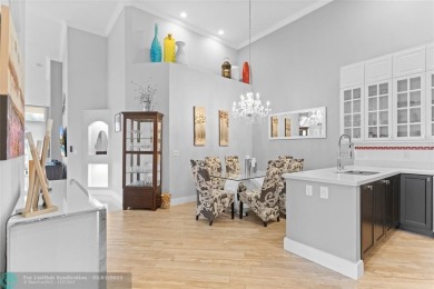Very rarely available corner villa overlooking a canal and the on Palm-Aire Country Club and Resort - The Oaks in Florida - for sale on GolfHomes.com, golf home, golf lot