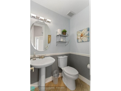 Very rarely available corner villa overlooking a canal and the on Palm-Aire Country Club and Resort - The Oaks in Florida - for sale on GolfHomes.com, golf home, golf lot