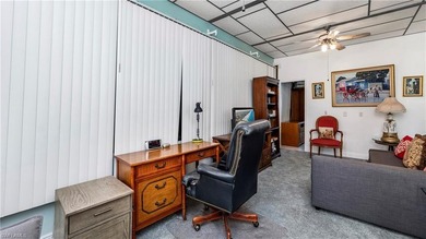 A golf cart is included, offering convenient access around the on The Rookery At Marco in Florida - for sale on GolfHomes.com, golf home, golf lot