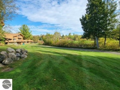 The relaxed Village of Schuss is where you find this turnkey on Schuss Mountain Golf Club in Michigan - for sale on GolfHomes.com, golf home, golf lot