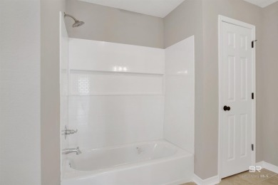 Golf course living and beach life converge at this immaculately on Glenlakes Golf Club in Alabama - for sale on GolfHomes.com, golf home, golf lot