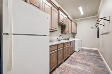 This Luxurious 5-Bedroom Home in Pecan Plantation with Upscale on Pecan Plantation Country Club in Texas - for sale on GolfHomes.com, golf home, golf lot