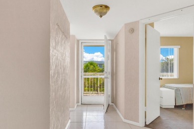 PRICED TO SELL! Enjoy this 2 bedroom lakefront condo with large on Poinciana Golf Club in Florida - for sale on GolfHomes.com, golf home, golf lot