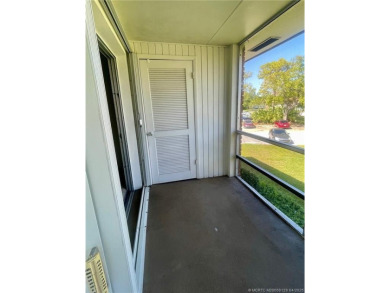 Enjoy the breeze on the screened lanai of this 1/1 2nd floor on Pine Lakes Golf Club in Florida - for sale on GolfHomes.com, golf home, golf lot