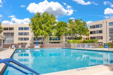 PRICED TO SELL! Enjoy this 2 bedroom lakefront condo with large on Poinciana Golf Club in Florida - for sale on GolfHomes.com, golf home, golf lot