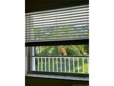 Enjoy the breeze on the screened lanai of this 1/1 2nd floor on Pine Lakes Golf Club in Florida - for sale on GolfHomes.com, golf home, golf lot