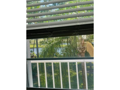 Enjoy the breeze on the screened lanai of this 1/1 2nd floor on Pine Lakes Golf Club in Florida - for sale on GolfHomes.com, golf home, golf lot