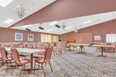 PRICED TO SELL! Enjoy this 2 bedroom lakefront condo with large on Poinciana Golf Club in Florida - for sale on GolfHomes.com, golf home, golf lot