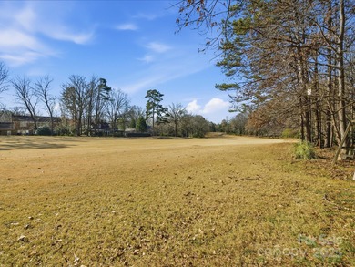 THIS IS THE ONE! It's on the 14th fairway of the south course of on Raintree Country Club in North Carolina - for sale on GolfHomes.com, golf home, golf lot
