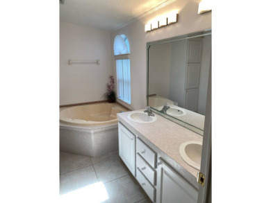 This home stands out from the rest. Three bedrooms, two baths on Sabal Springs Golf and Racquet Club in Florida - for sale on GolfHomes.com, golf home, golf lot