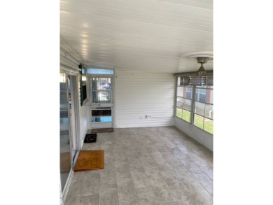 This home stands out from the rest. Three bedrooms, two baths on Sabal Springs Golf and Racquet Club in Florida - for sale on GolfHomes.com, golf home, golf lot