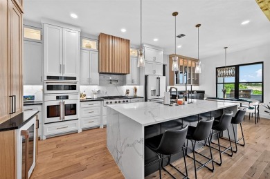 Experience modern luxury at 2028 Fox Bend Trace, a new custom on The Bridges Golf Club in Texas - for sale on GolfHomes.com, golf home, golf lot