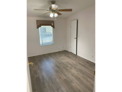 This home stands out from the rest. Three bedrooms, two baths on Sabal Springs Golf and Racquet Club in Florida - for sale on GolfHomes.com, golf home, golf lot