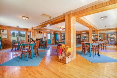 Discover this exquisite waterfront property situated on the on Barker Lake Country Club in Wisconsin - for sale on GolfHomes.com, golf home, golf lot