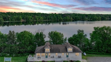 Discover this exquisite waterfront property situated on the on Barker Lake Country Club in Wisconsin - for sale on GolfHomes.com, golf home, golf lot