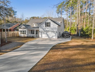 Like new, 2022 build, 4 bed/3  1/2  bath in Hagley Estates, with on The Founders Club At Pawleys Island in South Carolina - for sale on GolfHomes.com, golf home, golf lot