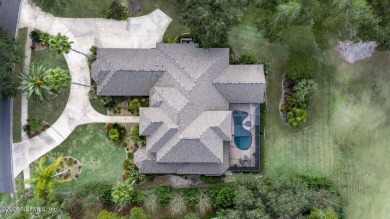Stunning 4,472 sq ft custom home in the beautiful Queens Harbor on Queens Harbour Yacht and Country Club in Florida - for sale on GolfHomes.com, golf home, golf lot