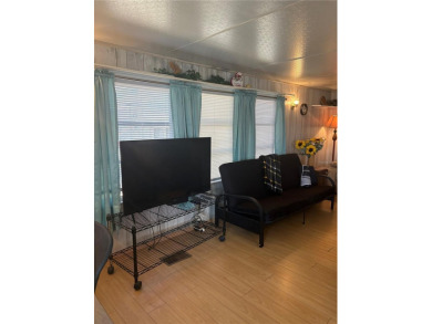 LOCATION, LOCATION, LOCATION!  This furnished doublewide home on Polo Park East in Florida - for sale on GolfHomes.com, golf home, golf lot