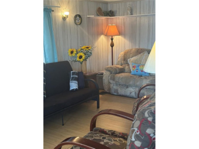LOCATION, LOCATION, LOCATION!  This furnished doublewide home on Polo Park East in Florida - for sale on GolfHomes.com, golf home, golf lot