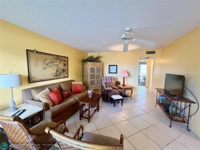 WATERVIEW! FIRST FLOOR, TWO BEDROOM, TWO FULL BATH HOME WITH A on Hillsboro Pines Golf in Florida - for sale on GolfHomes.com, golf home, golf lot